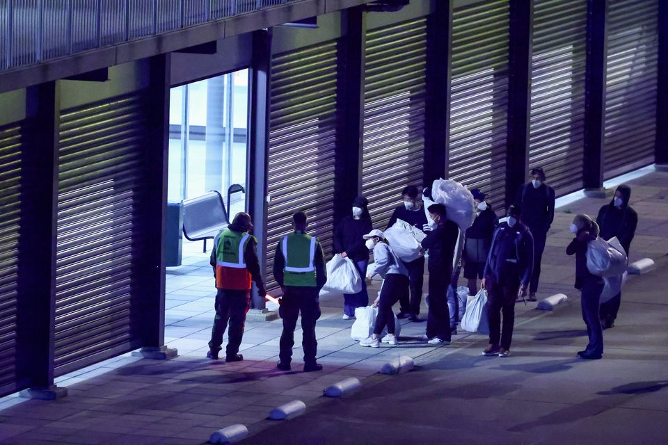 Passengers evacuated from the cruise ship MV Hondius following a hantavirus outbreak disembark at Eindhoven Air Base in the Netherlands. Photo: Reuters